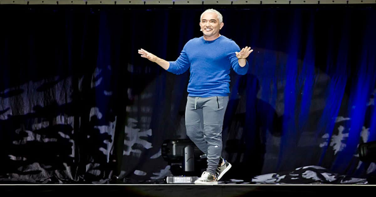 Cesar Millan speaks on stage during his show at the Max-Schmeling-Halle 