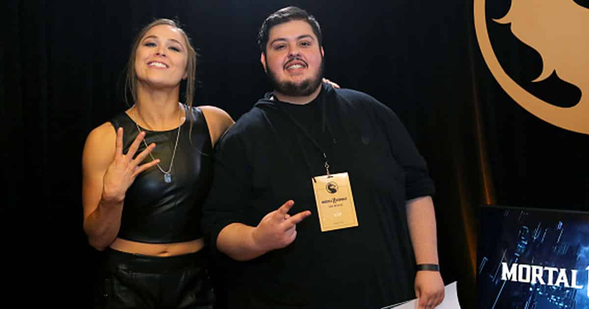 Ronda Rousey (L) backstage with artist Bosslogic at Mortal Kombat 11: The Reveal