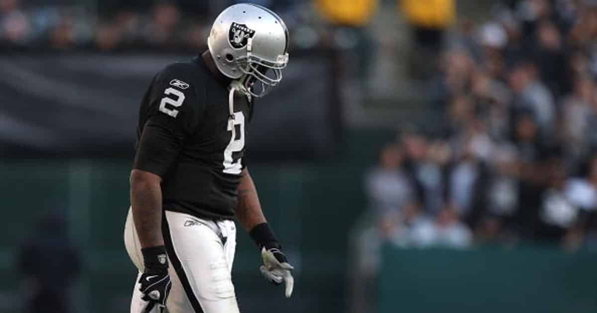 JaMarcus Russell #2 of the Oakland Raiders walks off the field against the Baltimore Ravens
